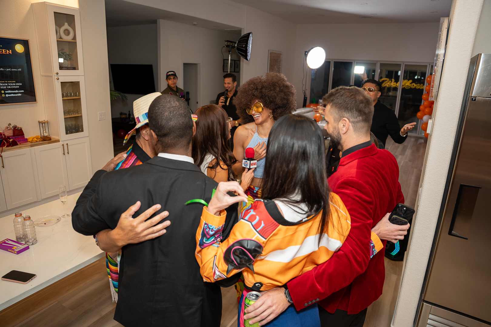 Friends sharing hugs during the REFC anniversary celebration