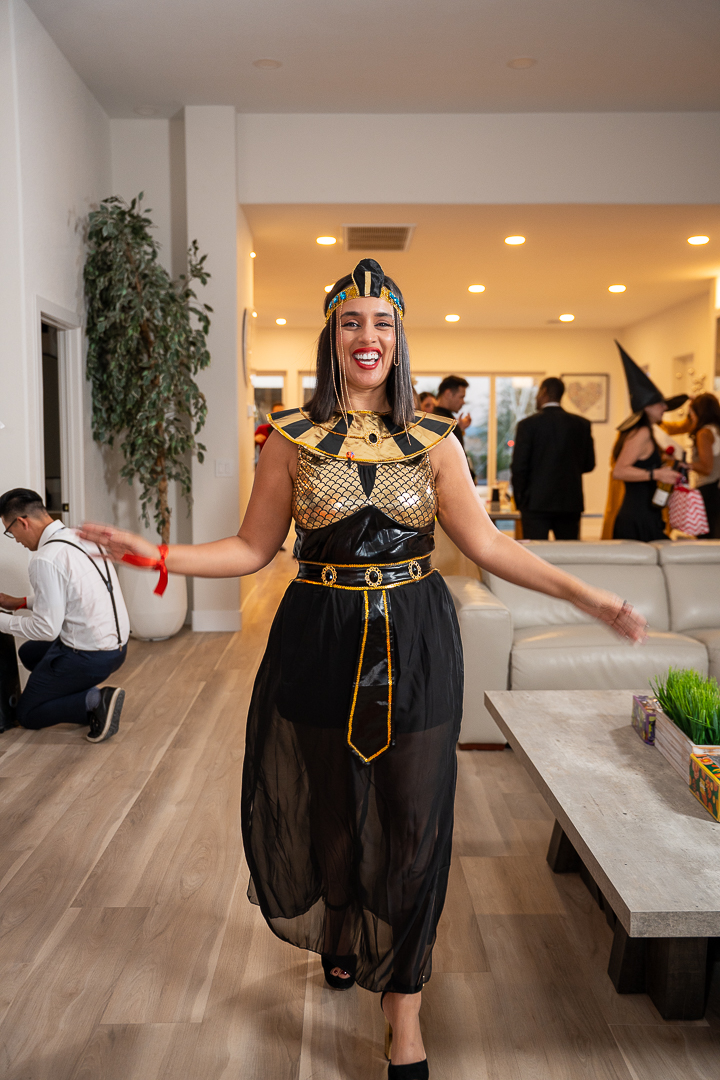 The pharaoh-costumed guest dancing with arms outstretched