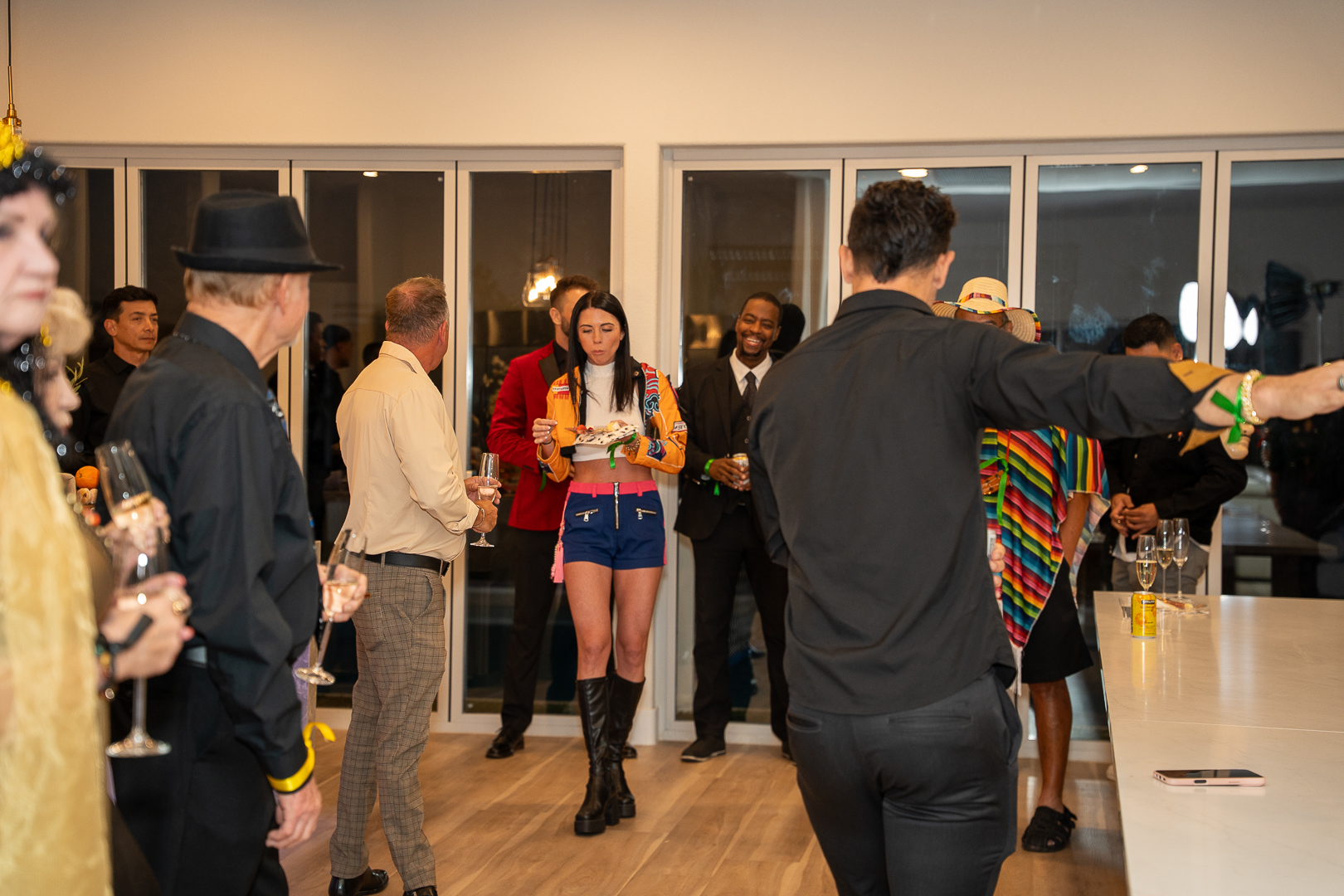 Guests mingling and dancing during the private REFC Halloween celebration