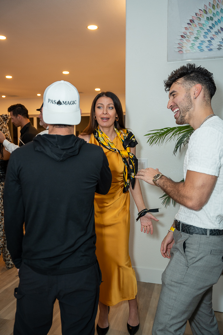 Guests chatting and enjoying drinks during the private Halloween mixer