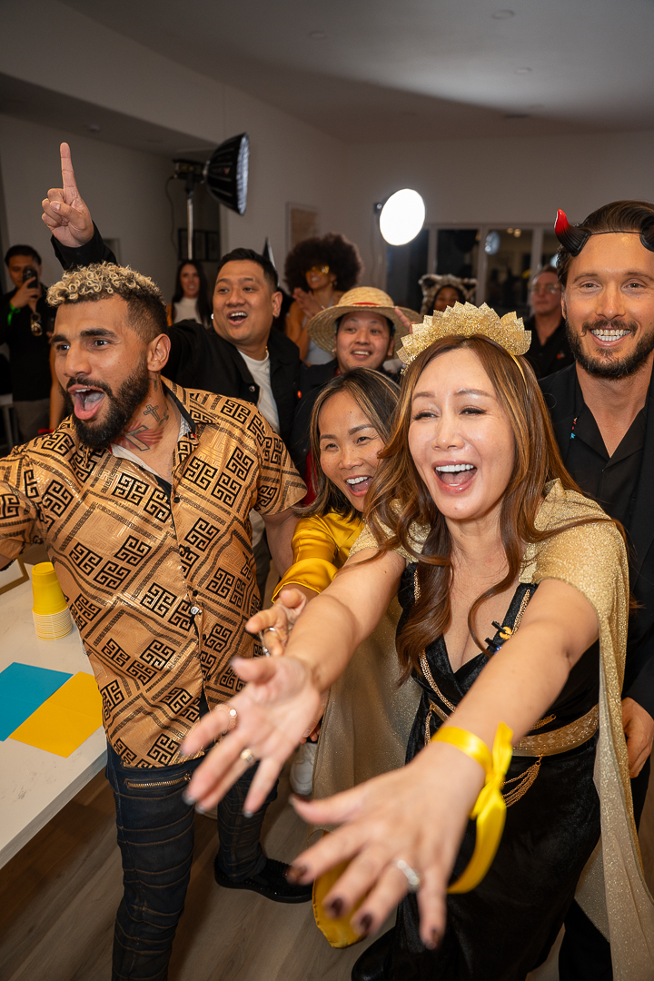 Friends cheering together during the REFC first-anniversary celebration