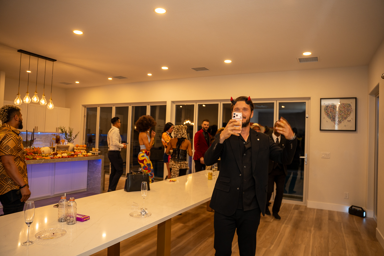 A guest speaking into a microphone at the REFC Halloween Mixer